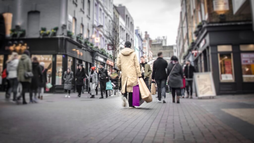 Retail network optimisation - a busy street with lots of people and shops