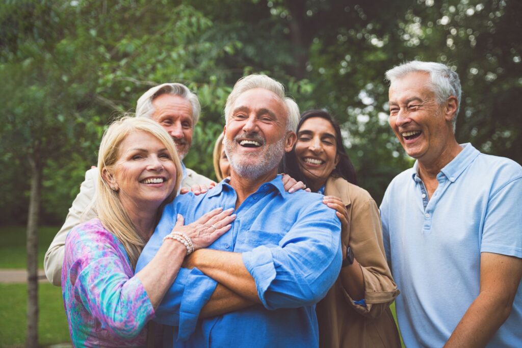Group of elderly seniors huddled together outside