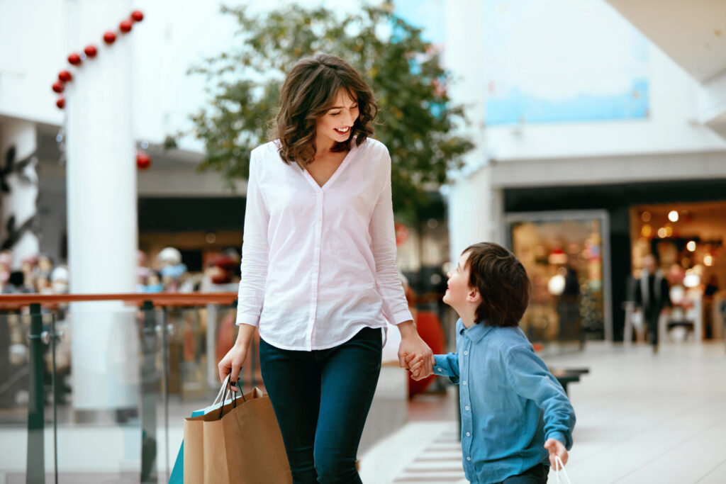 Centre Growth Model - Mother and her child shopping together in a indoor shopping centre